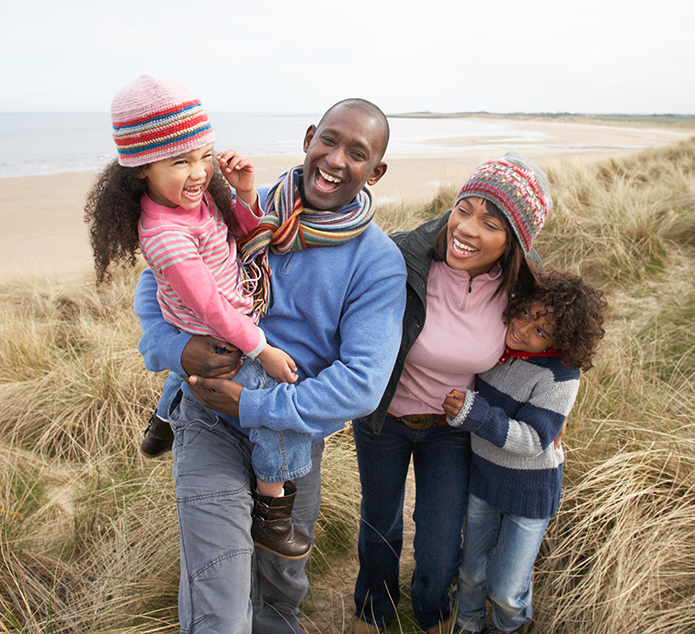 family is walking on the seaside 